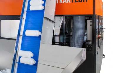 Transportador a granel de alimentación de botellas de plástico entrando en el posicionador rotativo